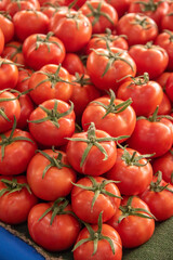 nice ripe red tomatoes on market counter, no people