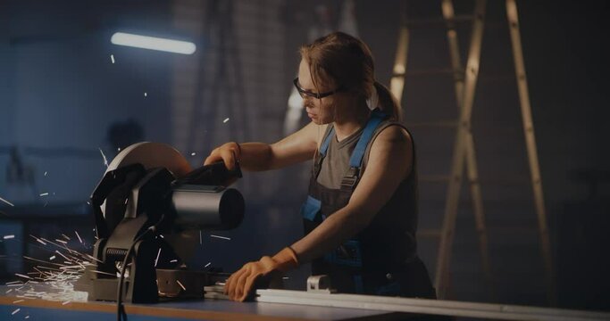 Professional woman working on metal cutting equipment