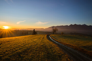 sunrise over the village road