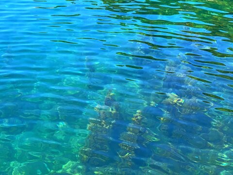 Turquoise sea crystal clear magical tranquil ripples water background. Paradise calm light blue green watercolor ocean surface at summertime. Zen meditation dream tranquility aqua mood.
