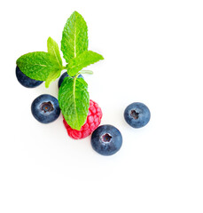 Fresh mix berries isolated on white background.  Raspberry, Blueberry and Mint leaf, flat lay. Top view. Food creative layout.