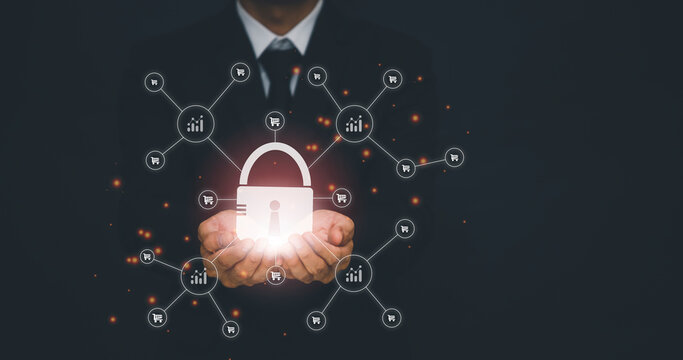 Businessman holding Big key Security to online Shopping in graph Screen Icon of a media screen,Technology Process System Business concept. online Shopping and Protection Hacker concept.