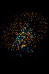 Fireworks light up  at New Year Eve. Abstract Festive background with fireworks sparkles. Copyspace.