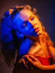 portrait of a girl illuminated by colorful lanterns