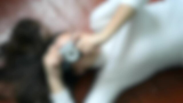 Blurred background. Brunette Girl floor lie antique camera model