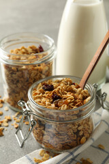 Concept of tasty breakfast with granola on gray background