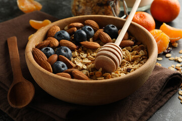 Concept of tasty breakfast with granola on black smokey background