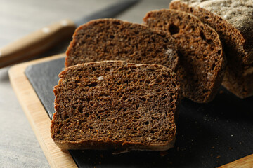 Board with fresh rye bread, close up