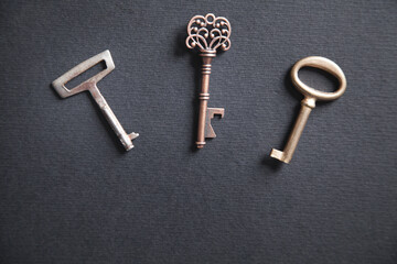 Old keys on the black background.