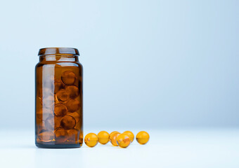 a glass jar with pills is on the table