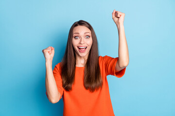 Portrait of her she attractive cheerful cheery glad brown-haired girl celebrating great news rejoicing isolated on bright vivid blue color background