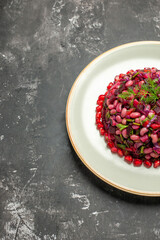 front view vinaigrette salad with pomegranates and beans on the dark background food health salad