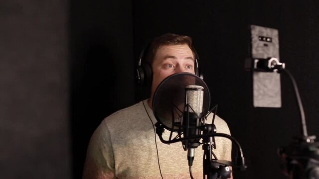 A professional announcer makes a recording in the studio