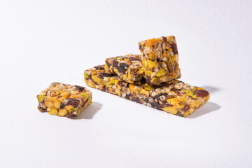 Muesli Bars with cereal and pistachio on wooden background