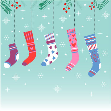 Multicolored Christmas socks for gifts in winter nature.