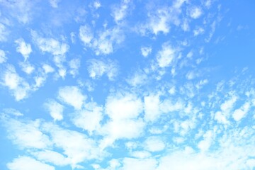 Smooth white clouds and blue sky for background.