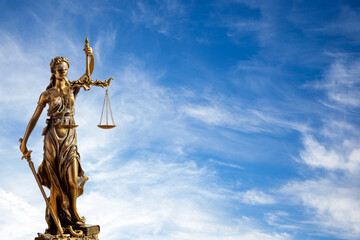 Statue of justice. Close-up Of Justice Lady Against blue sky Background.