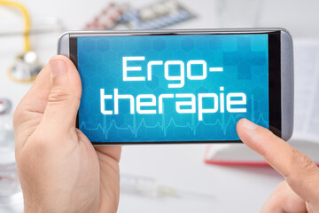 Smartphone mit dem Text Ergotherapie auf dem Display