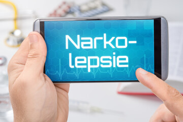 Smartphone mit dem Text Narkolepsie auf dem Display