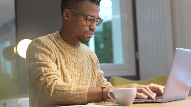 Portrait of african american trendy guy in a distant online call