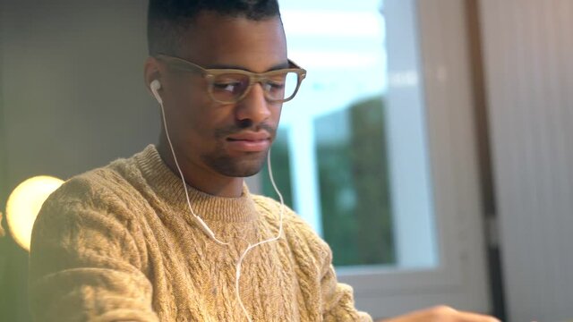 Portrait of african american trendy guy in a distant online call