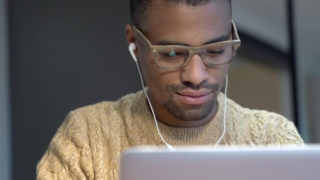 Portrait of african american trendy guy in a distant online call