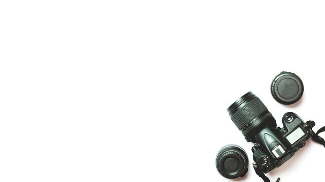 top view of a digital camera, flash, accessories on a white background. Photo equipment.