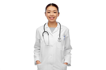 Fototapeta premium medicine, profession and healthcare concept - happy smiling asian female doctor in white coat with stethoscope