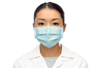 health, medicine and pandemic concept - portrait of young asian female doctor wearing face...