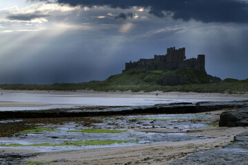 Bamburgh castle on the UK Northumberland coast with added skies.