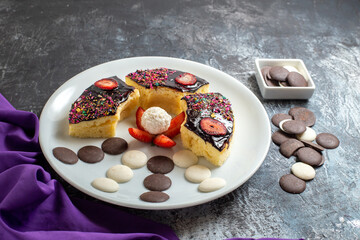 front view yummy cake slices with choco cookies on dark background cake dessert sweet