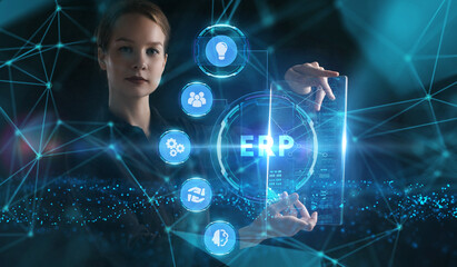 Business, Technology, Internet and network concept. Young businessman working on a virtual screen of the future and sees the inscription: ERP