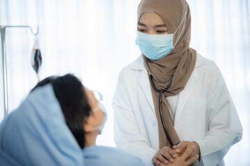 muslim asian woman doctor, Professional muslim doctor working in hospital, healthcare and medicine