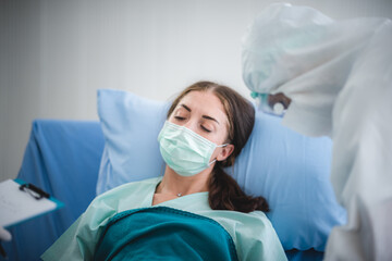 Infected patient in quarantine lying in bed in hospital, coronavirus COVID-19 concept