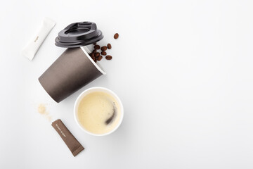 Coffee in black paper cup on white background