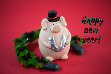 
Piggy with shamrocks and horseshoes, happy new year