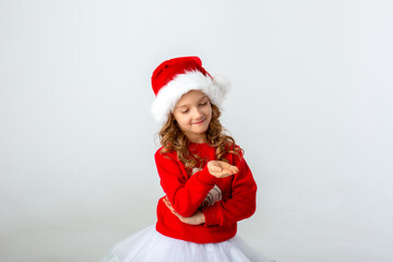 girl in a santa hat on a white background