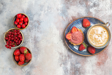top view cup of coffee with cake and red fruits on a light background sweet biscuit cakea