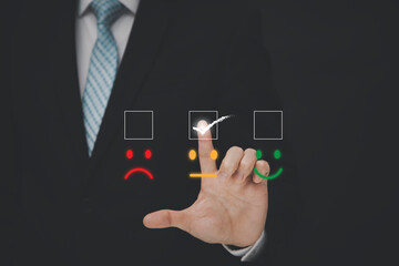 Businessman people are touching the virtual screen on the happy and unhappy Smile face icon in service in the black background, Customer service and Satisfaction concept ,