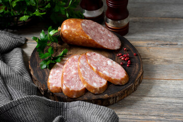 Sausage. Smoked sausage with spices on a wooden serving Board. Tasty meat sausages made from turkey meat	
