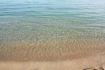 Soft beautiful ocean wave on sandy beach. Background