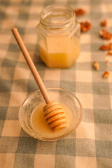 Honey with honey spoon in warm colors