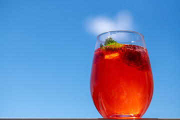 Summer refreshing cocktail with strawberries, ice and fresh mint leaves.