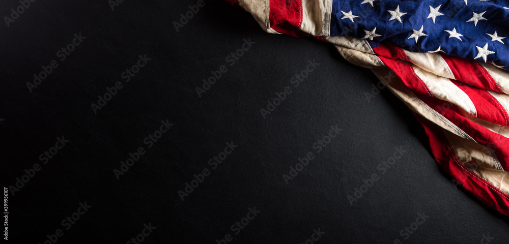 Wall mural Martin Luther King Day anniversary concept. American flag against black wooden background