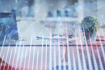 Double exposure of financial graph drawing and office interior background. Concept of stock market.