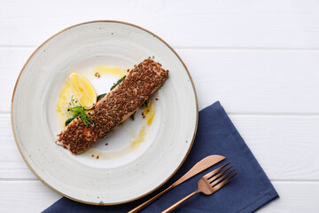 Roasted salmon fillet in plate on white wooden table