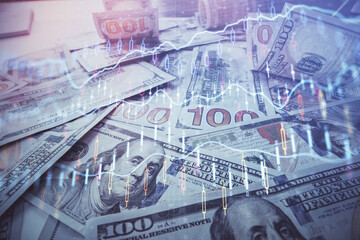 Multi exposure of forex chart drawing over us dollars bill background. Concept of financial success markets.