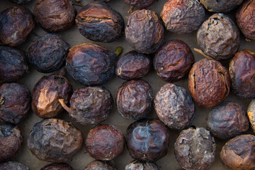 Walnuts in shell close-up background