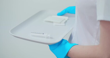 CU Nurse holding tray with vaccine