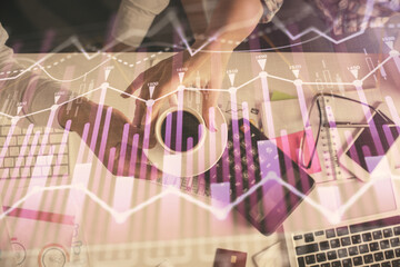 Double exposure of man and woman working together and financial chart hologram drawing. market analysis concept. Computer background. Top View.